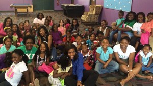 Members of Alpha Kappa Alpha Sorority, Incorporated pose with children in the Oxford-Lafayette community.