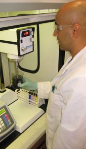Sasan Nouranian conducting research in the Chemical Engineering laboratory.