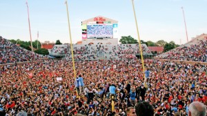 Students storm the field following a 23-17 victory over the top-ranked Alabama Crimson Tide.