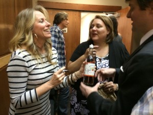 Country artist and songwriter Deana Carter signs a bottle of wine after "The Heart Behind the Music" for a fan at the Ford Center. 