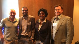 Left to right: John Cassimus, a successful entrepreneur and Ole Miss supporter, UM students Dwight Barnes and Jasmine Brown, who were awarded seed money for their clothing company, and Bill Fry, chair of the Rebel Venture Capital Fund.