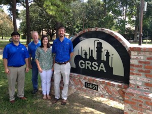 Ann Marie DeLee (center) poses with her supervisors at GRSA. (Submitted photo)
