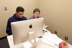 Sebastian Saiz, a junior forward on the Ole Miss men's basketball team, works with an academic counselor in the FedEx Student-Athlete Success Center.