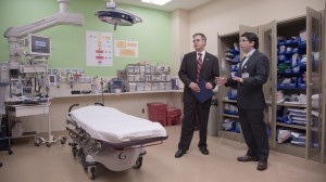 Dr. Jeffrey Vitter (left), the University of Mississippi's new chancellor, gets an explanation of how the trauma room at the pediatric ED operates from emergency medicine pediatrician Dr. Benjamin Dillard. 