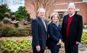 UM Foundation President Wendell Weakley (left) greets Ole Miss Women's Council for Philanthropy Chair Karen Moore and Madison Charitable Foundation Director Joc Carpenter in front of The Mentor statue near the Gertrude C. Ford Center for the Performing Arts.