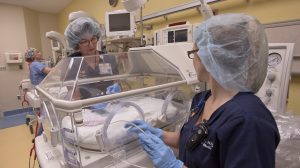 Nurse practitioners Diane Dukes, left, and Melanie Ellis show the new neonatal resuscitation area, which includes state-of-the-art Giraffe beds and other life-saving equipment.