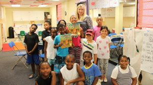 CELI literacy specialist Angie Caldwell reads "An Ambush of Tigers" to children at Willie Price University Lab School.