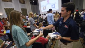 2016 Orientation leaders pass out copies of this year’s Common Reading Experience selection, ‘Ten Little Indians.' Photo by Thomas Graning/Ole Miss Communications