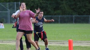Ole Miss student Mary Evelyn Webb and Special Olympics athlete Taylor Rosenthal participate in the Unified Rebels flag football team.