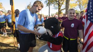 Ole Miss ROTC received the Egg Bowl game ball from MSU ROTC in Calhoun City. The cadets ran 43 miles to bring the ball to Oxford Monday, Nov. 21. Photo by Thomas Graning/Ole Miss Communications