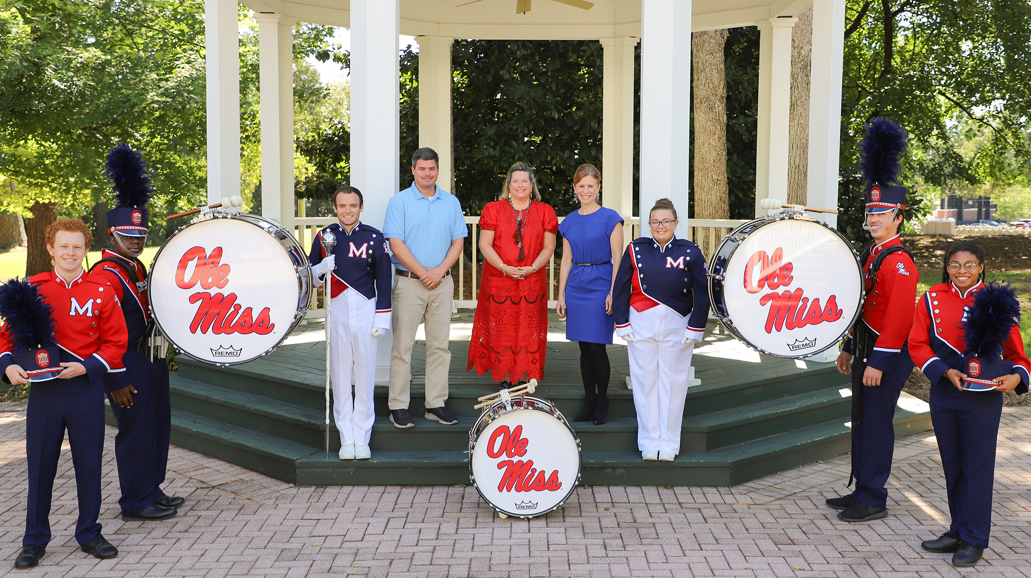 Helen Overstreet poses with members of the band 
