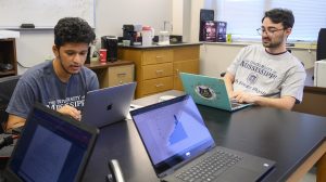 physics students work with simulated data