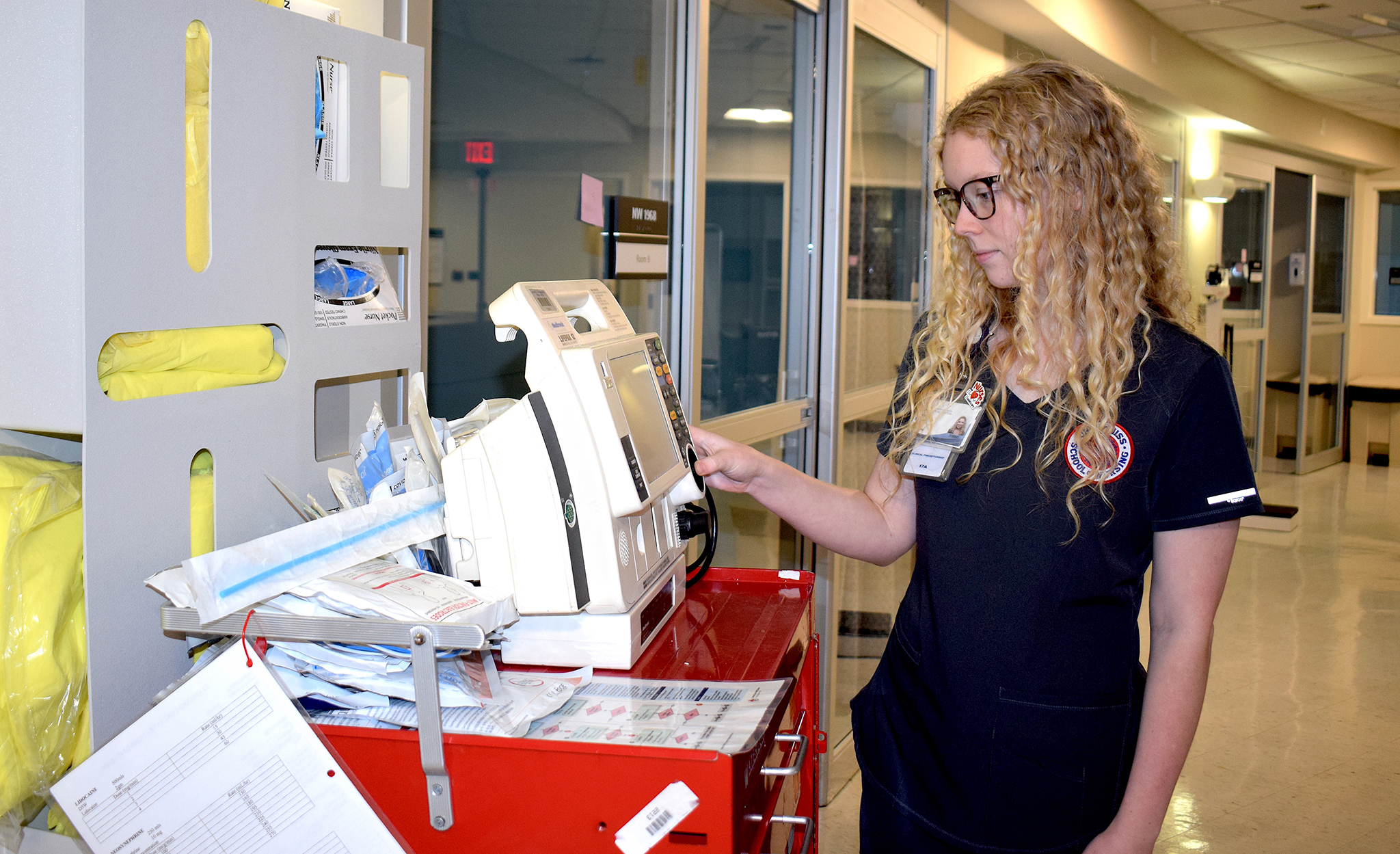 Kaylee Hillhouse checks a monitor in a clinical teaching lab at the UM South Oxford Center. Photo by Pam Starling/Division of Outreach and Continuing Education