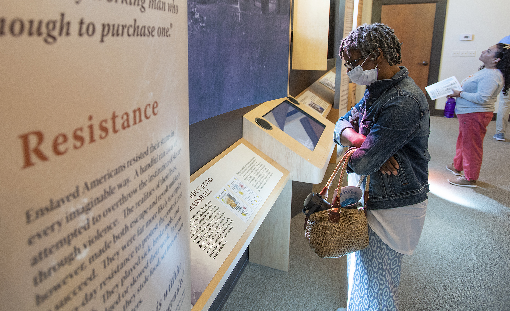 Margaret Gipson, who attended the Civil Rights in Oxford Town bus tour, looks at exhibits in the Burns-Belfry Museum and Multicultural Center. Gipson’s grandfather, Roger Thompson, was a custodian when James Meredith integrated the university in 1962. Photo by Thomas Graning/Ole Miss Digital Imaging Services