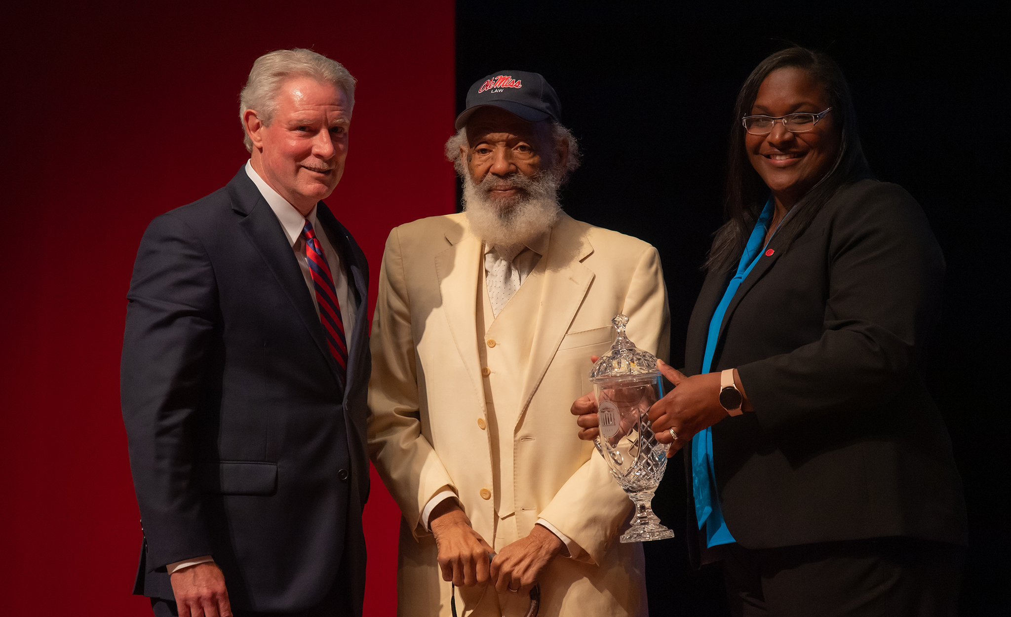 Chancellor Glenn Boyce (left) and Shawnboda Mead (right), vice chancellor for diversity and community engagement, present James Meredith with the Mississippi Humanitarian Award. The honor is one of the university’s most distinguished awards. Photo by Kevin Bain/Ole Miss Digital Imaging Services