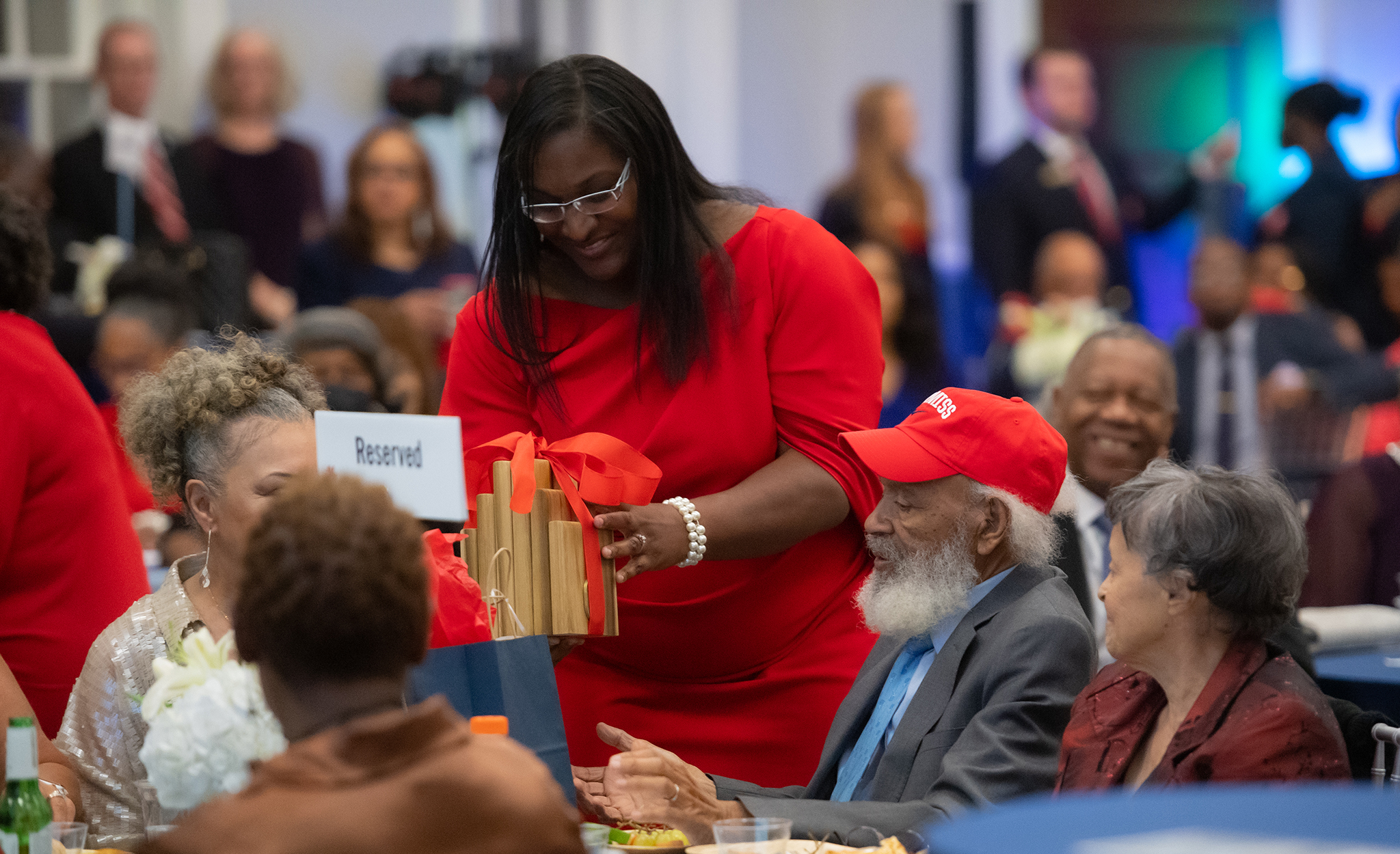 Shawnboda Mead (center), vice chancellor for diversity and engagement and chair of the 60th anniversary of integration committee, gives James Meredith a gift of appreciation for his presence during the week. Photo by Kevin Bain/Ole Miss Digital Imaging Services