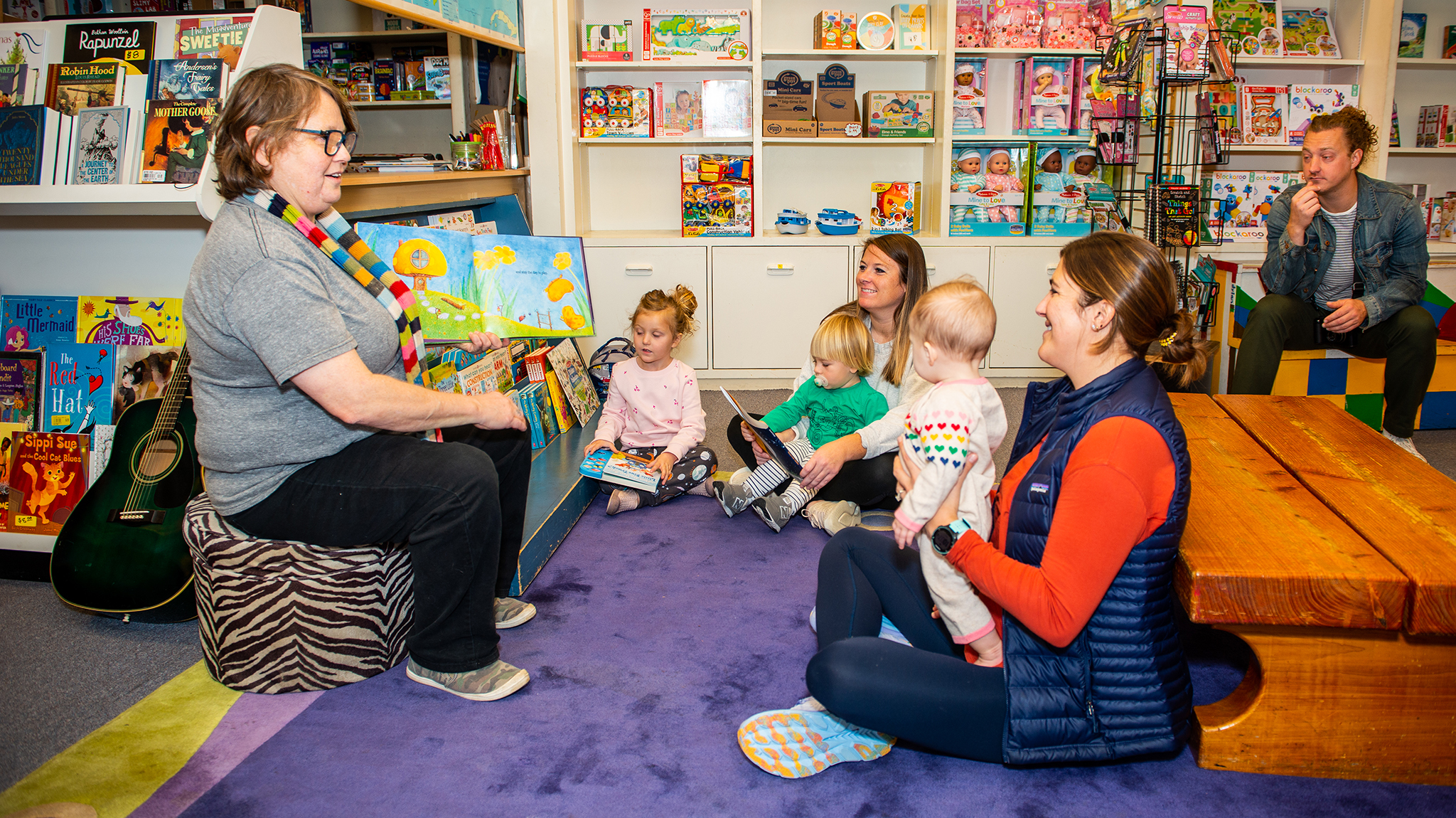 Jilleen Moore (left) leads story time at Square Books Jr. in Oxford with Juniper Dutson, Benjamin and Michele Ard, Anne Carter and Sarah Abraham, and Dylan Dutson. Just like story time, the Children’s Book Festival at the university encourages a love of reading, and the festival has received major support from the family of the late Elaine Hoffman Scott of Little Rock, Arkansas. Scott believed that ‘every person should have the chance to experience everything books can bring,’ daughter Melissa Scott says. Photo by Bill Dabney/UM Foundation