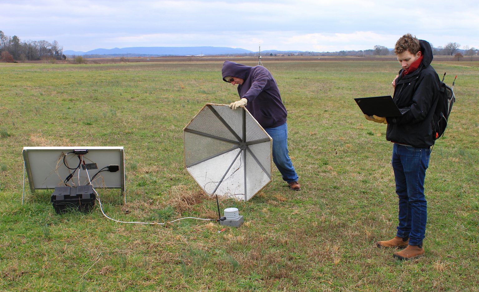 Brian Carpenter (left) and Hank Buchanan, two research and development engineers at the University of Mississippi’s National Center for Physical Acoustics, work on an infrasound array sensor at Alabama A&M University’s Winifred Thomas Agricultural Research Station north of Huntsville in 2020. Photo by Shea Stewart/UM Office of Research and Sponsored Programs