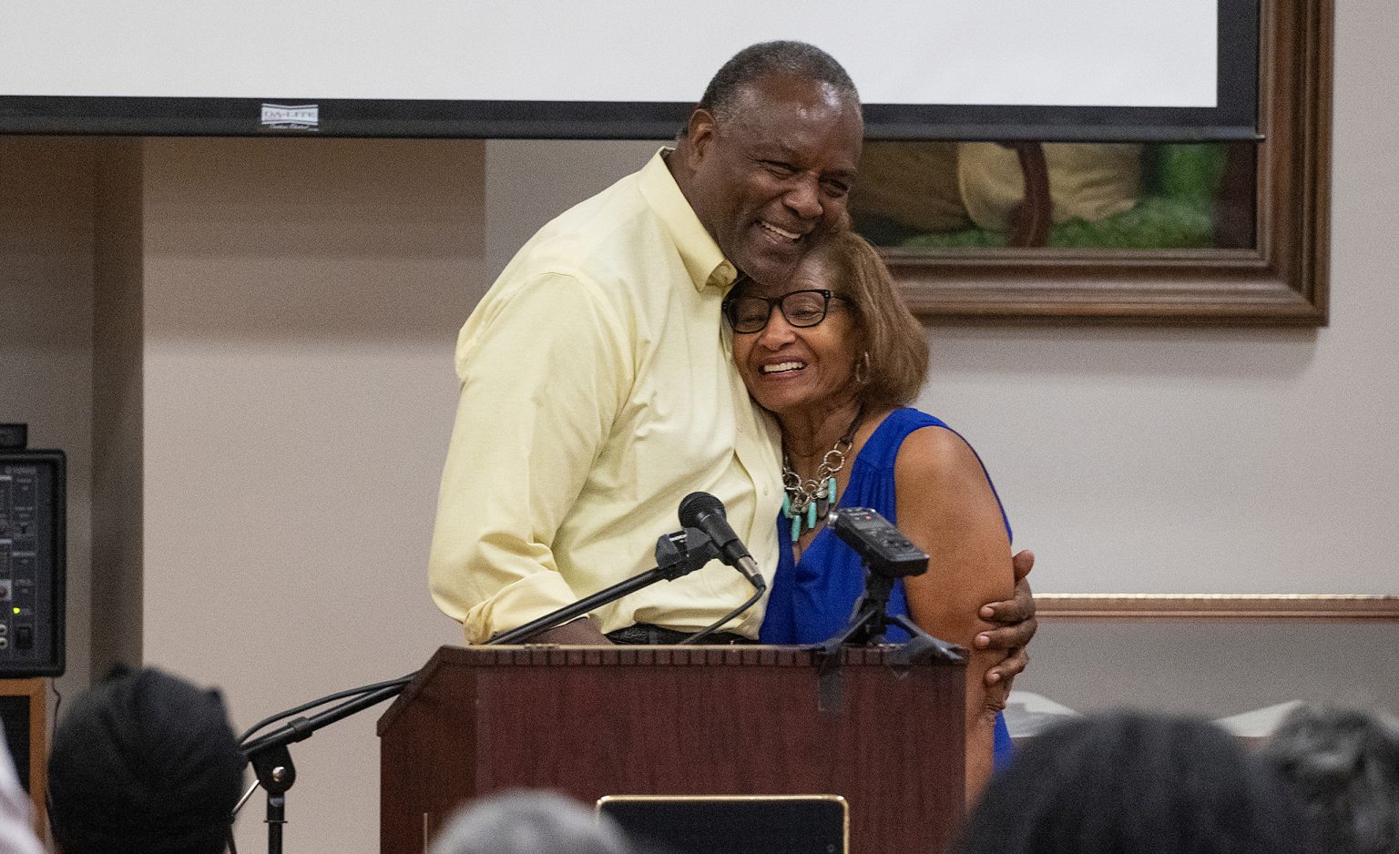 Dottie Chapman Reed (right) is greeted by former Ole Miss and NFL football player Curtis Weathers in September 2022 in the university’s J.D. Williams Library. Photo by Thomas Graning/Ole Miss Digital Imaging Services