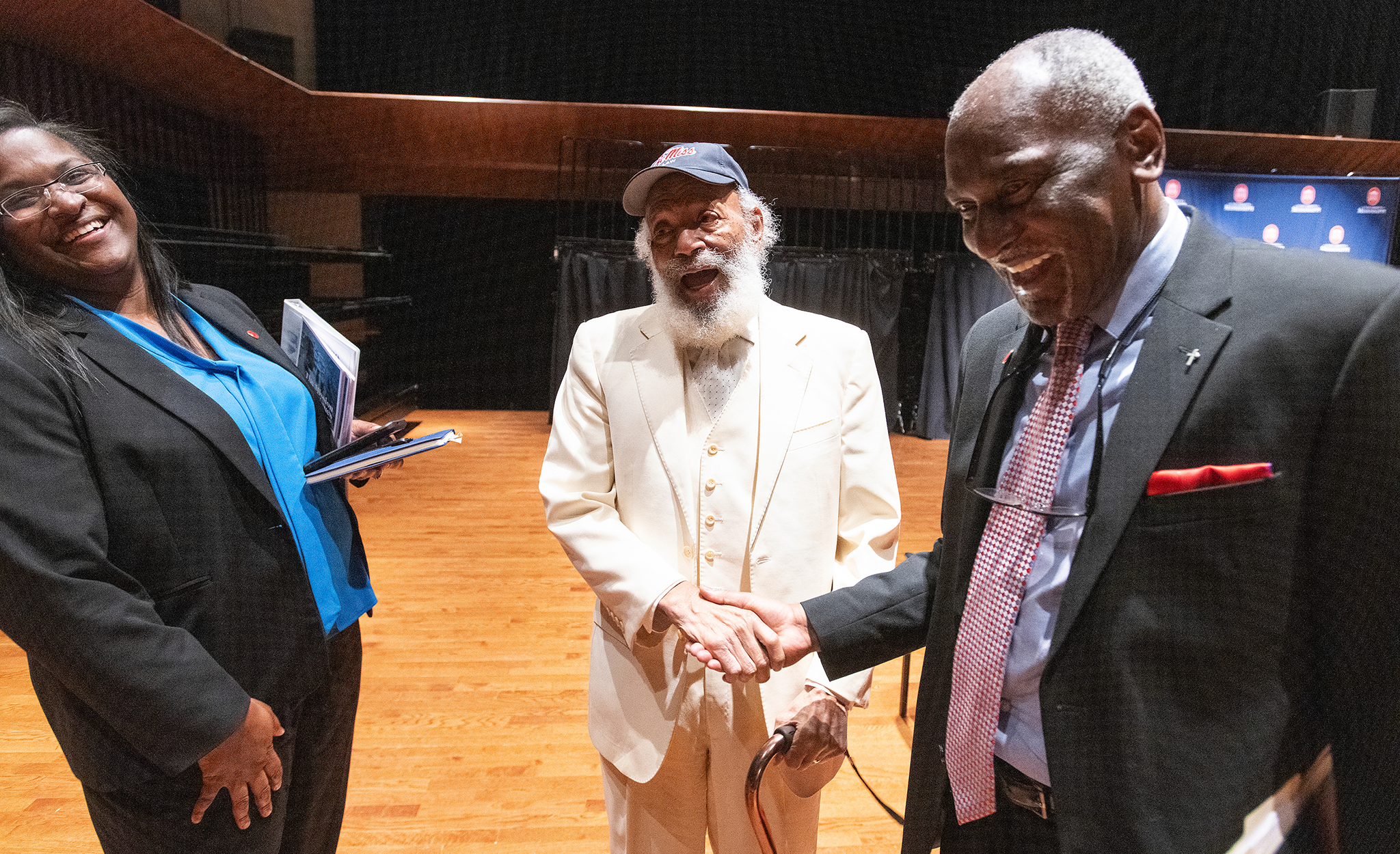 James Meredith (center) shares a moment with Shawnboda Mead (left), vice chancellor for diversity and inclusion; and Donald Cole, special assistant to the chancellor for multicultural affairs emeritus, following an event in the university’s observance of its 60th anniversary of integration. Meredith and his family will be on hand April 11 for the Honoring Excellence in Diversity Awards ceremony, one of the final events in the anniversary series. Photo by Thomas Graning/Ole Miss Digital Imaging Services