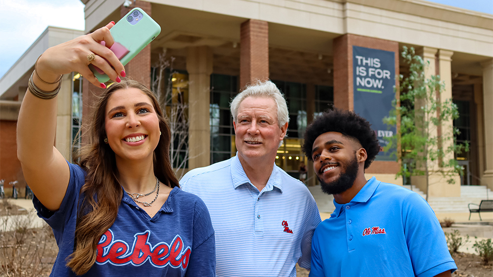Chancellor Glenn Boyce (center) takes a selfie with Ole Miss students while helping produce video and social media messages for Giving Day 2023, which will help strengthen the student experience, academic programs and community offerings. Participants can support their choice of 27 compelling campus projects, including the university’s 10 schools and the College of Liberal Arts, the Gertrude C. Ford Center for the Performing Arts, UM Museum and Historic Houses, and the Pride of the South Marching Band. Photo by Eva Luter/University Development