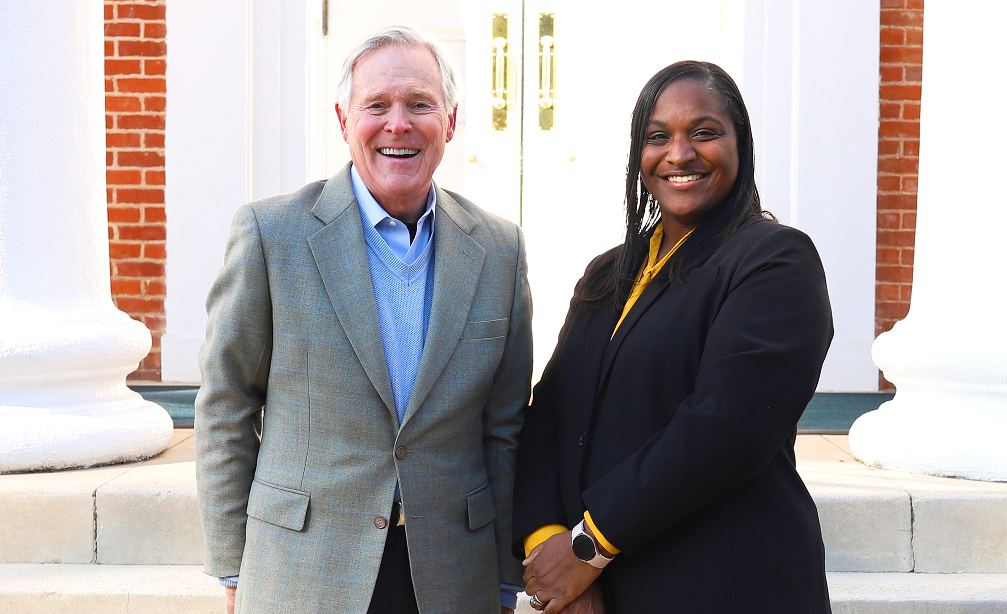 Ole Miss alumnus and former Mississippi Gov. Ray Mabus (left) visits with Shawnboda Mead, vice chancellor for diversity and community engagement. Mabus is challenging alumni and friends of the university to support the Diversity and Community Engagement Fund on Giving Day. Photo by Kirsten Simpson/University Development
