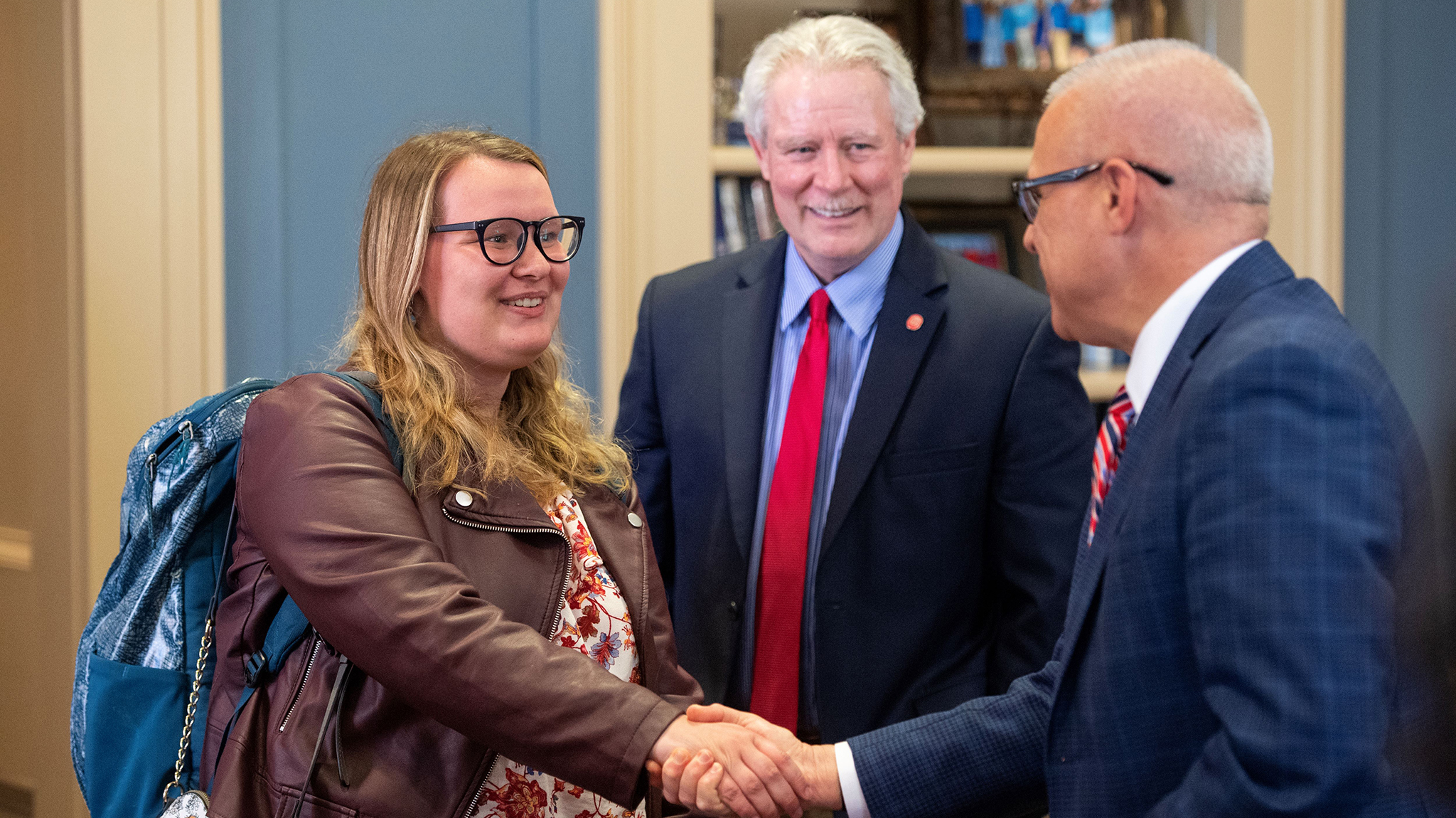 Provost Noel Wilkin (right) and Chancellor Glenn Boyce (center) congratulate Madeleine Dotson for becoming a 2023 Truman Scholar on Monday (April 10) in the chancellor’s office in the Lyceum. Dotson is the university’s 18th winner of the prestigious national scholarship for aspiring leaders. Photo by Thomas Graning/Ole Miss Digital Imaging Services