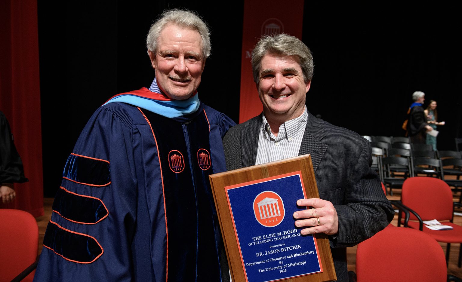 Chancellor Glenn Boyce (left) congratulates Jason Ritchie, associate professor of chemistry and biochemistry, as the 2023 recipient of the Elsie M. Hood Outstanding Teacher Award at the university’s Honors Day Convocation. Photo by Thomas Graning/Ole Miss Digital Imaging Services