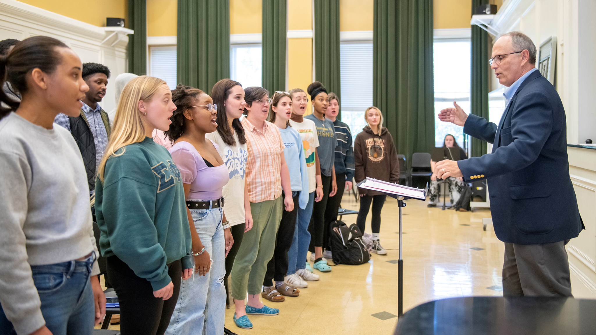 The UM Concert Singers rehearse numbers for their European tour, where they will sing in historic cathedrals and give a special memorial performance at Omaha Beach. The 10-day tour, set for May 17-27, includes multiple stops in Belgium and France. Photo by Sri Chattopadhyay/Ole Miss Digital Imaging Services