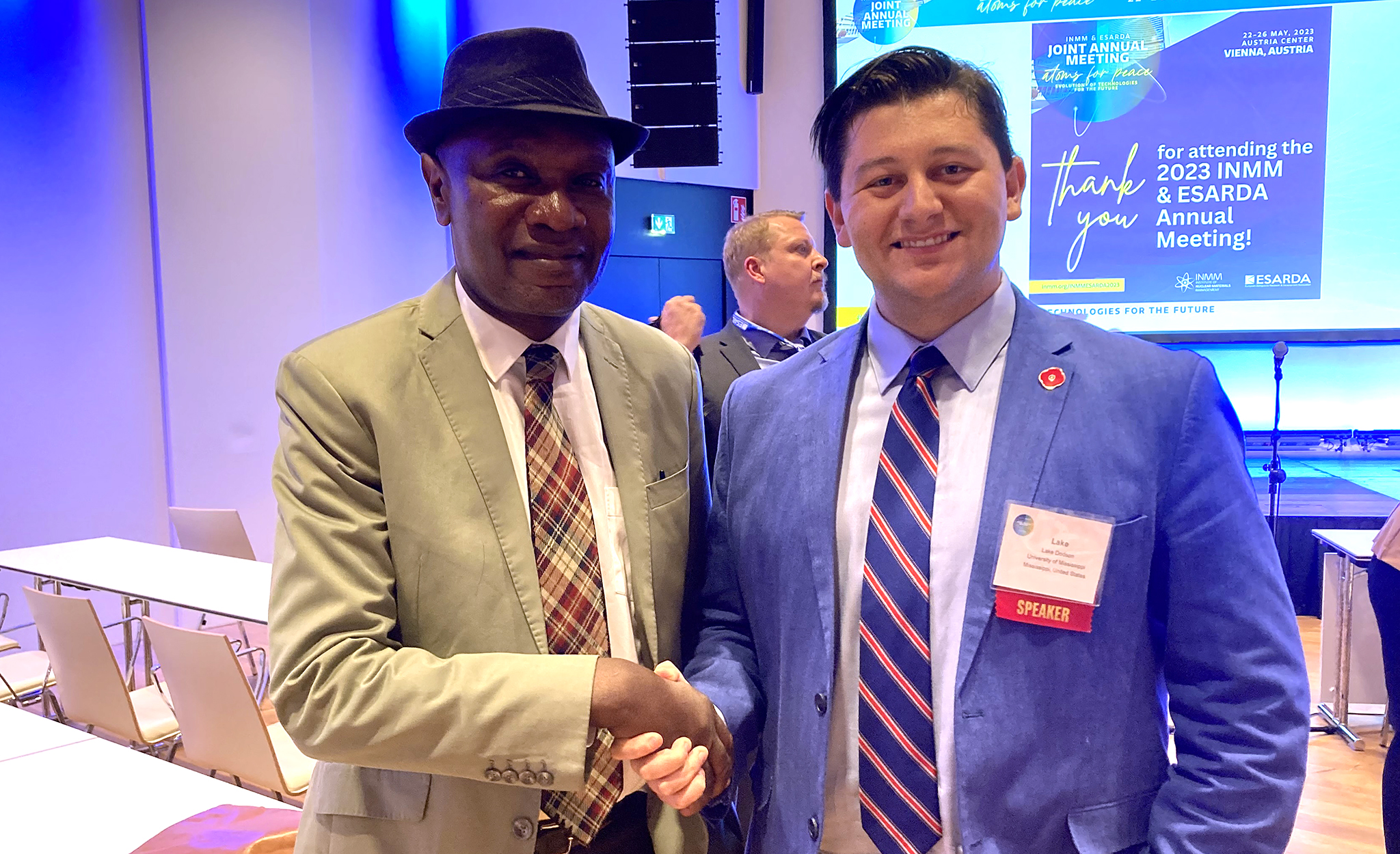 senior Lake Dodson (right) meets Enobot Agboraw, executive secretary of the African Commission on Nuclear Weapons, following Dodson’s presentation at the Atoms for Peace conference in Vienna. Dodson spoke at the meeting on the potential for thorium to provide energy for developing countries. Submitted photo
