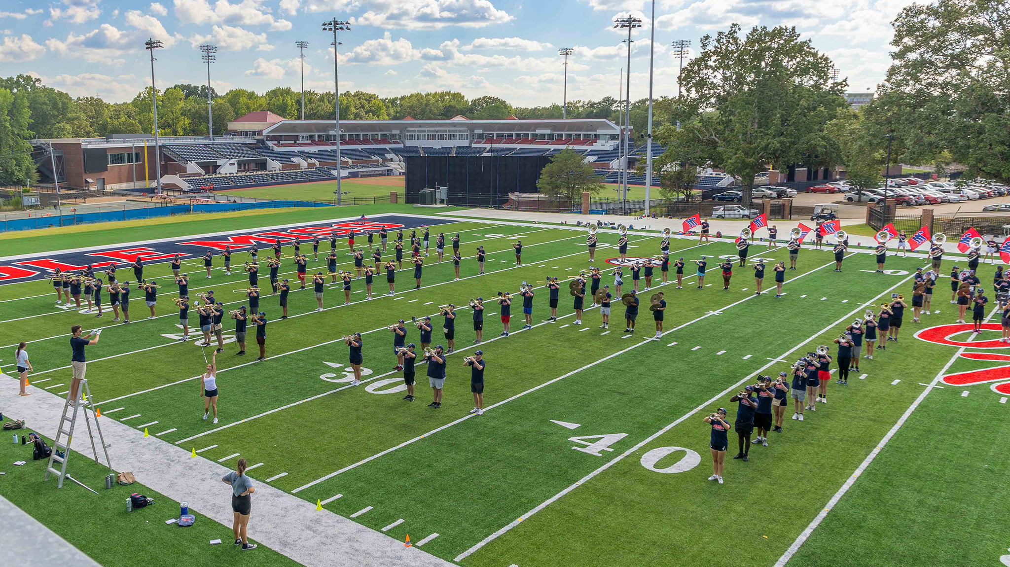 The Pride of the South marching band practices Tuesday (Aug. 29) on its new practice field, which is a replica of Hollingsworth Field at Vaught-Hemingway Stadium. The band members say their performances will be better prepared and polished during this football season because of the upgraded facility. Photo by Amy Howell/University Development
