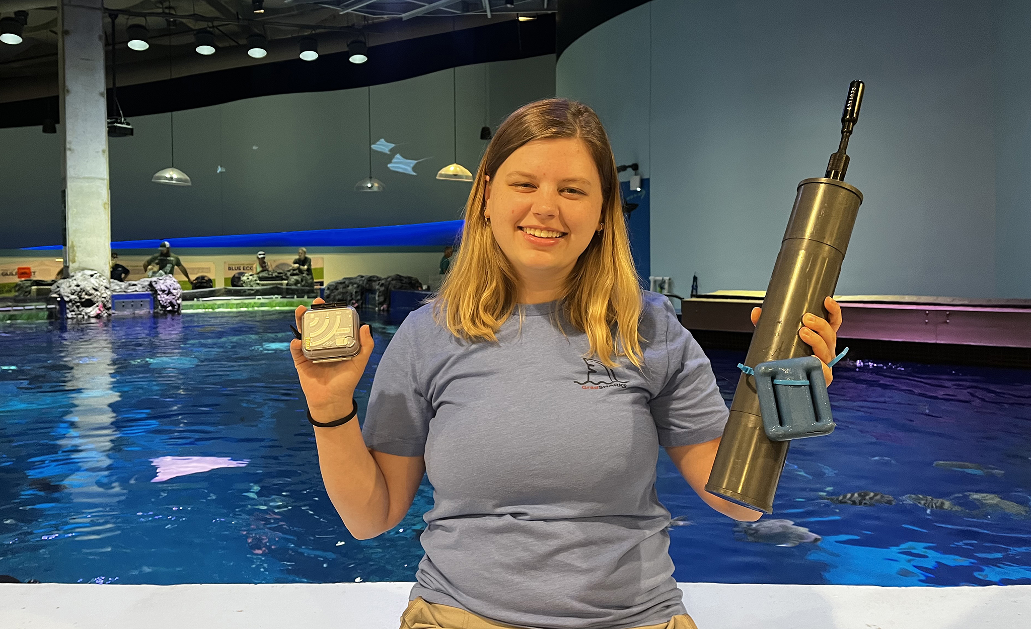 Kayleigh Mazariegos shows off some of the equipment she used to capture the sounds of underwater creatures in the Gulf of Mexico at the Mississippi Aquarium. Mazariegos partnered with the aquarium on the study, which aims to determine whether fish vocalizations can be used to identify various species. Submitted photo