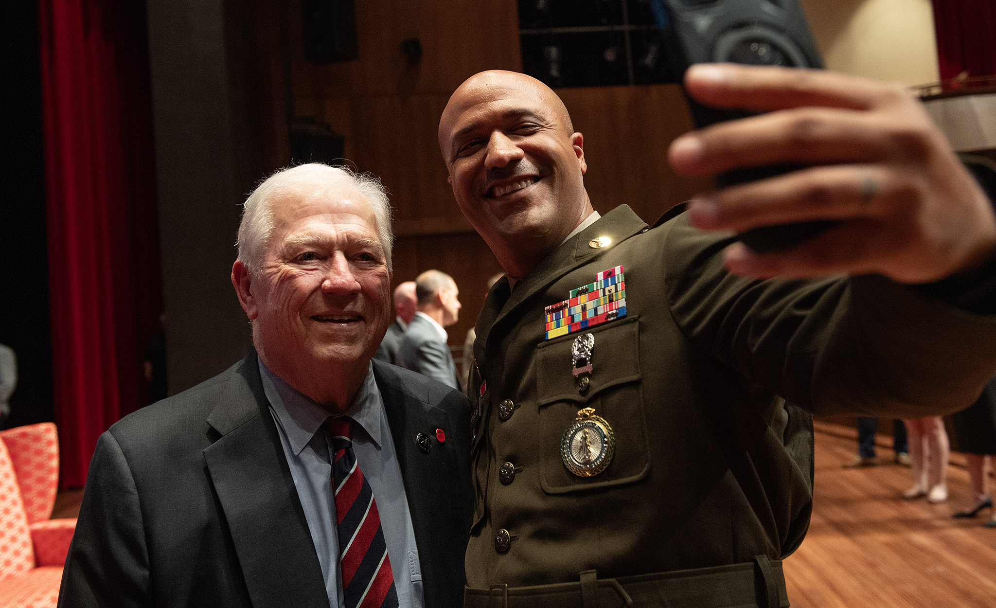 Master Sgt. Anthony Douglas (right), operations coordinator for UM Veteran and Military Services and recruiting and retention section chief for the Mississippi Army National Guard, poses for a photo with former Mississippi Gov. Haley Barbour after the ‘Follow Me: Citizens, Soldiers and Crisis Leadership’ panel Sept. 14 at the Gertrude C. Ford Center for the Performing Arts. Photo By Thomas Graning/Ole Miss Digital Imaging Services