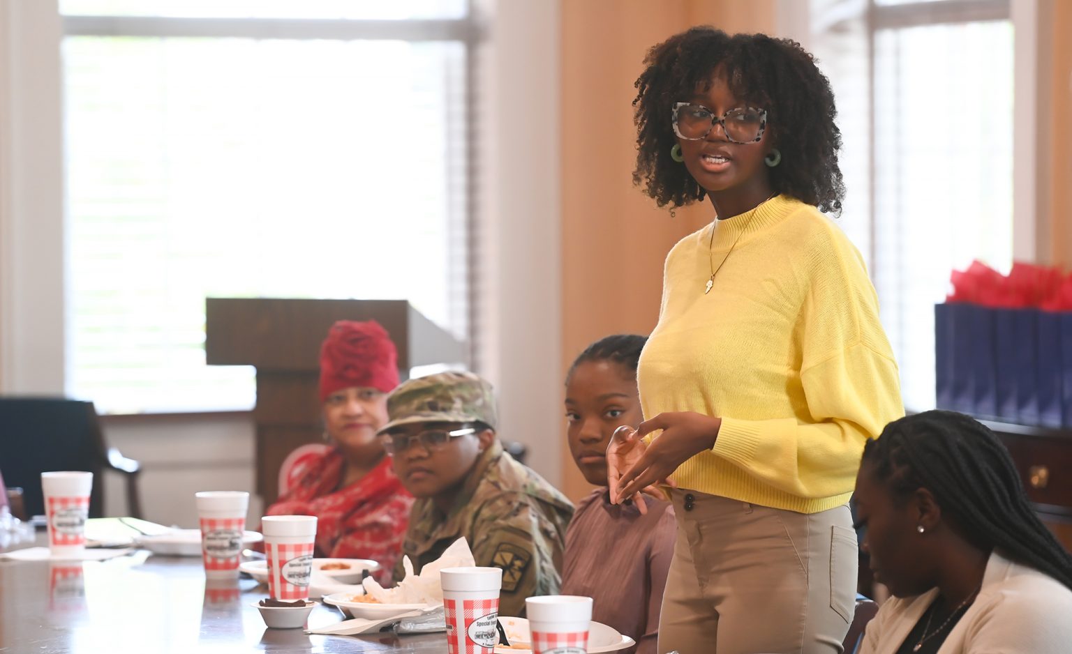 Fatimah Wansley, a sophomore international studies major from Jackson, introduces herself during a luncheon for recipients of the Ole Miss 8 scholarship. Wansley is among the inaugural recipients of the new award. Photo by Kevin Bain/Ole Miss Digital Imaging Services