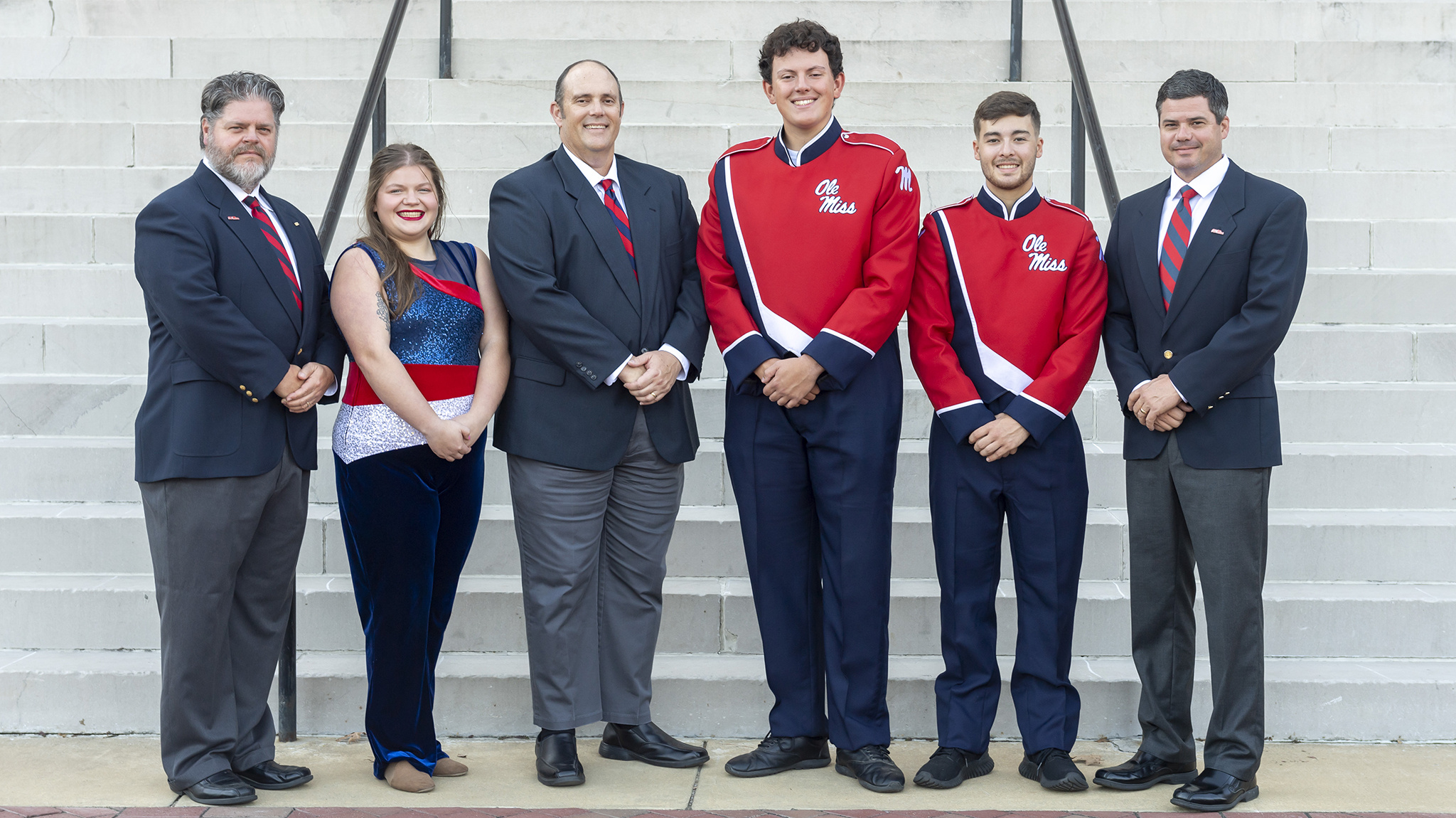 For the first time ever, all the Pride of the South marching band ‘s directors have children in the band. The directors and their children are (from left) Mel Morse and his daughter, Emily Morse; Tim Oliver and his son, Ben Oliver; and Cooper Dale and his dad, Randy Dale. Photo by Srijita Chattopadhyay/Ole Miss Digital Imaging Services